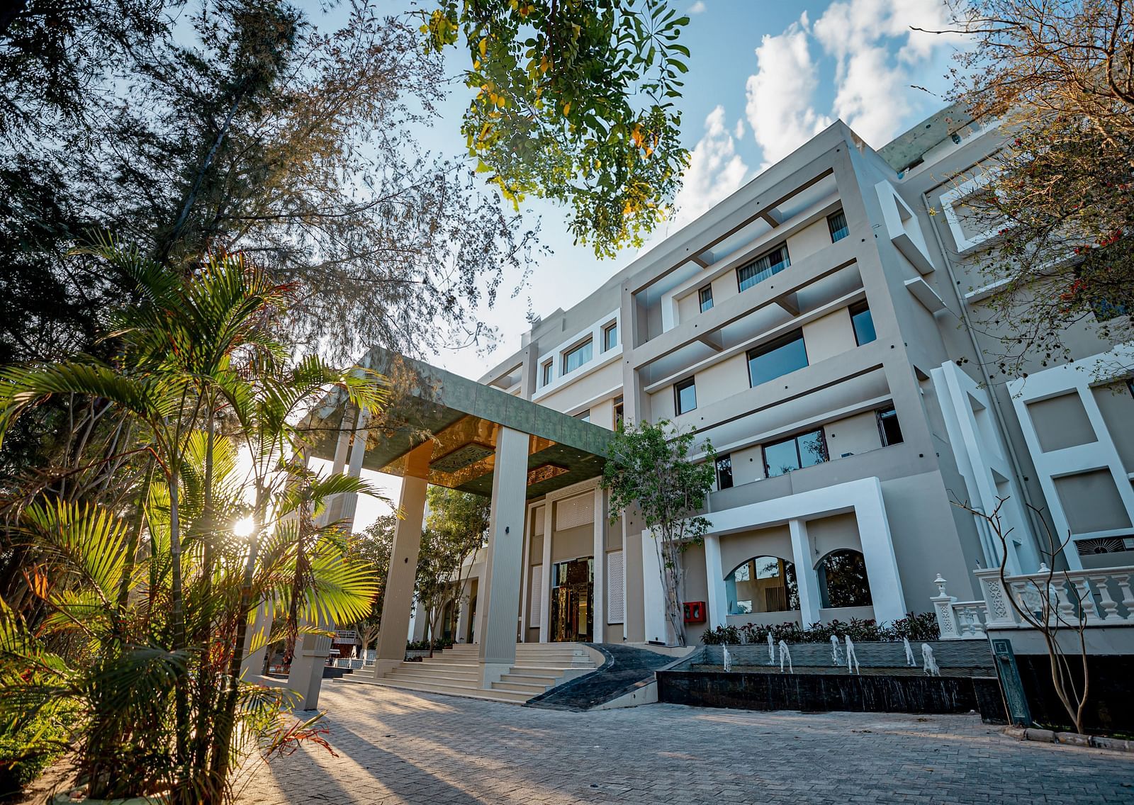 Facade of Essentia Luxury Resort & Spa, Udaipur taken from a low angle.