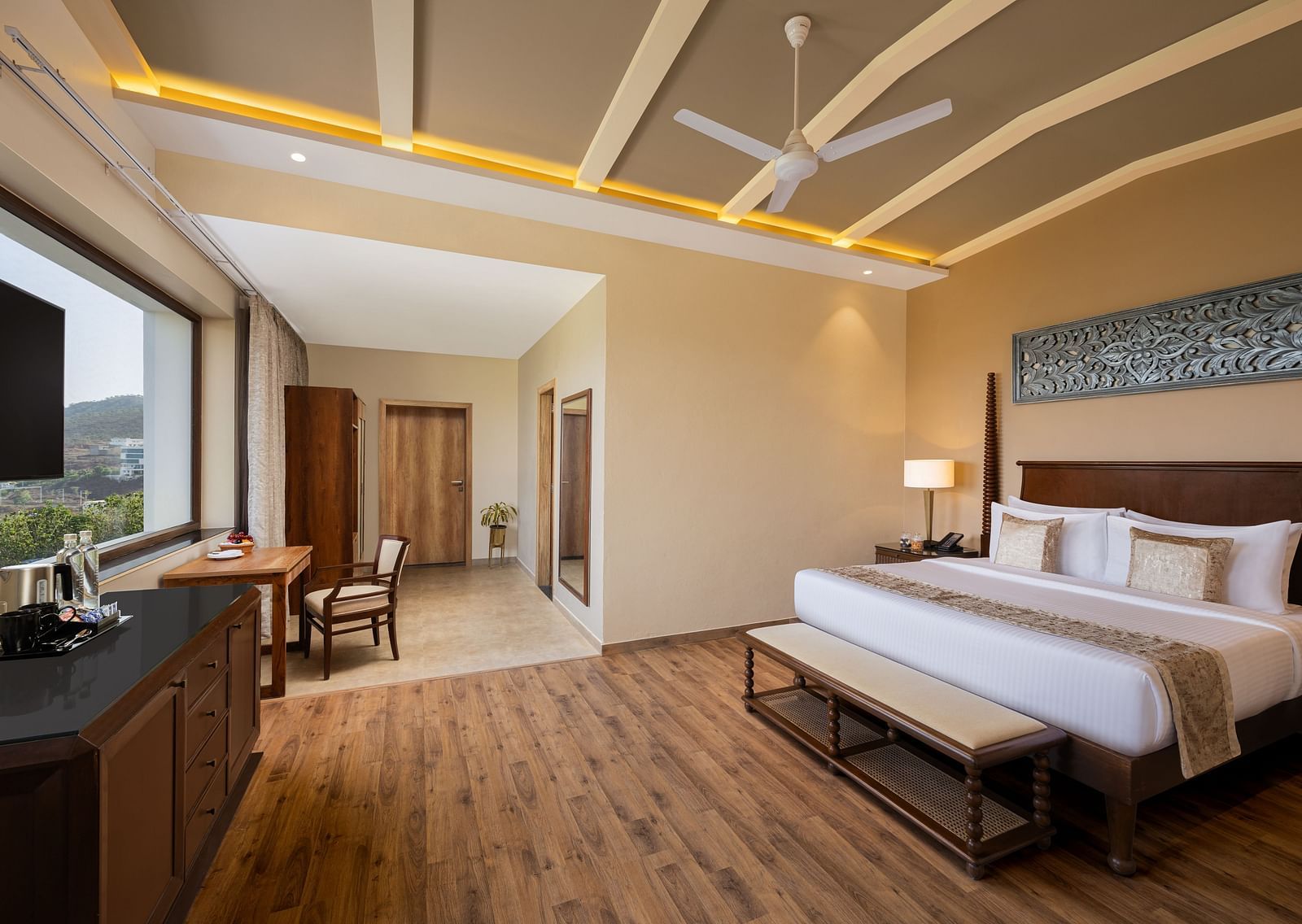 Executive Suite Room with double beds placed in front of TV at Essentia Luxury Resort & Spa, Udaipur.