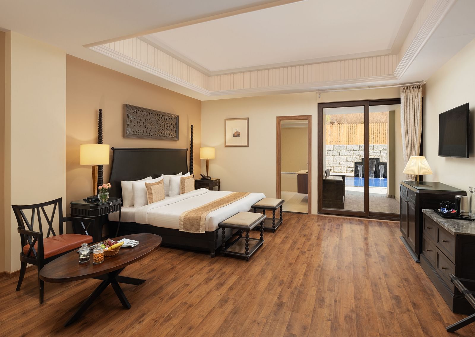 Presidential Suite Room with double beds placed in front of TV at Essentia Luxury Resort & Spa, Udaipur.