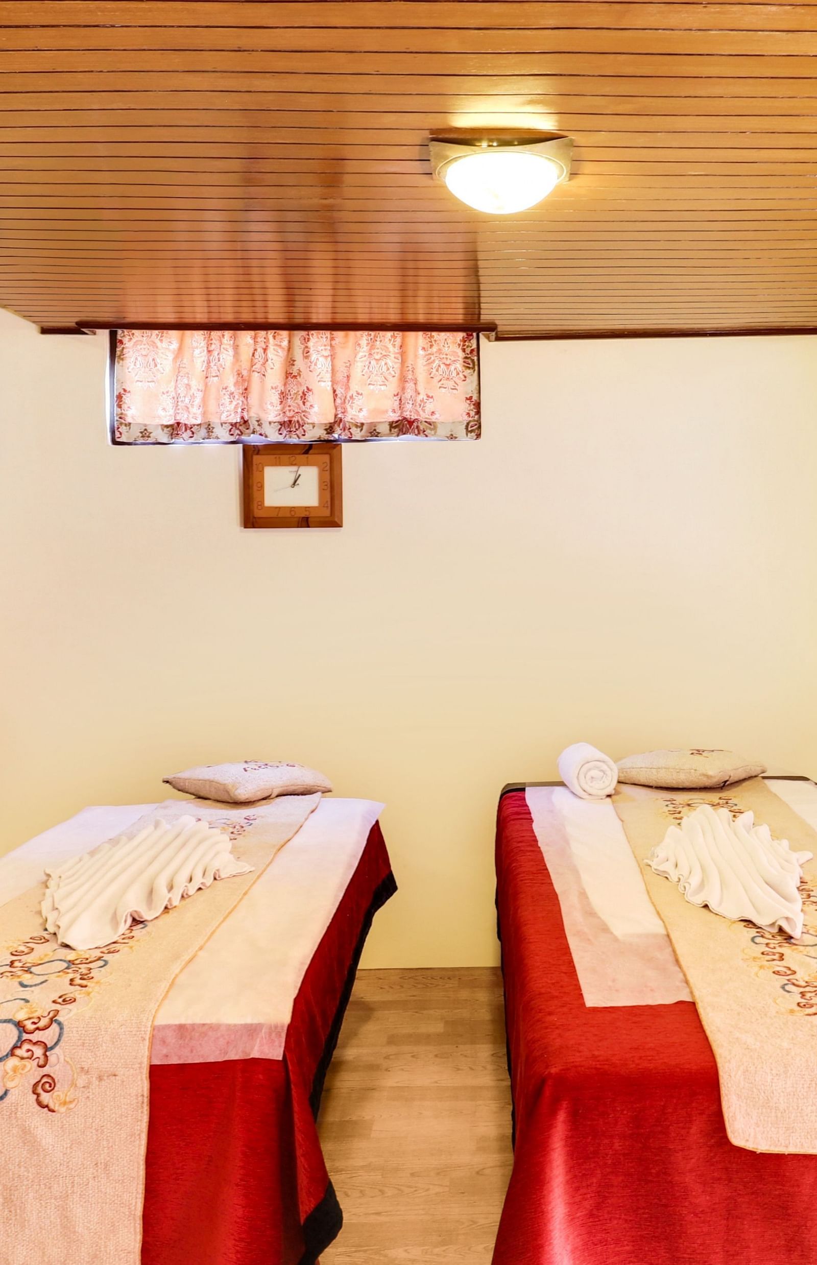 The spa area is meticulously arranged with cushions, plush sheets and neatly folded towels at Summit Norling Resort & Spa, Gangtok.