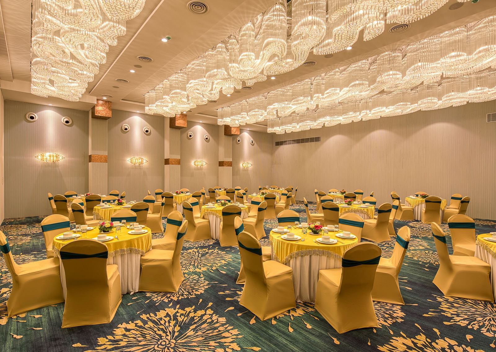 Yellow coloured chairs in the Sumo Anaika Banquet Hall at Le Foliage by TGI, Bangalore