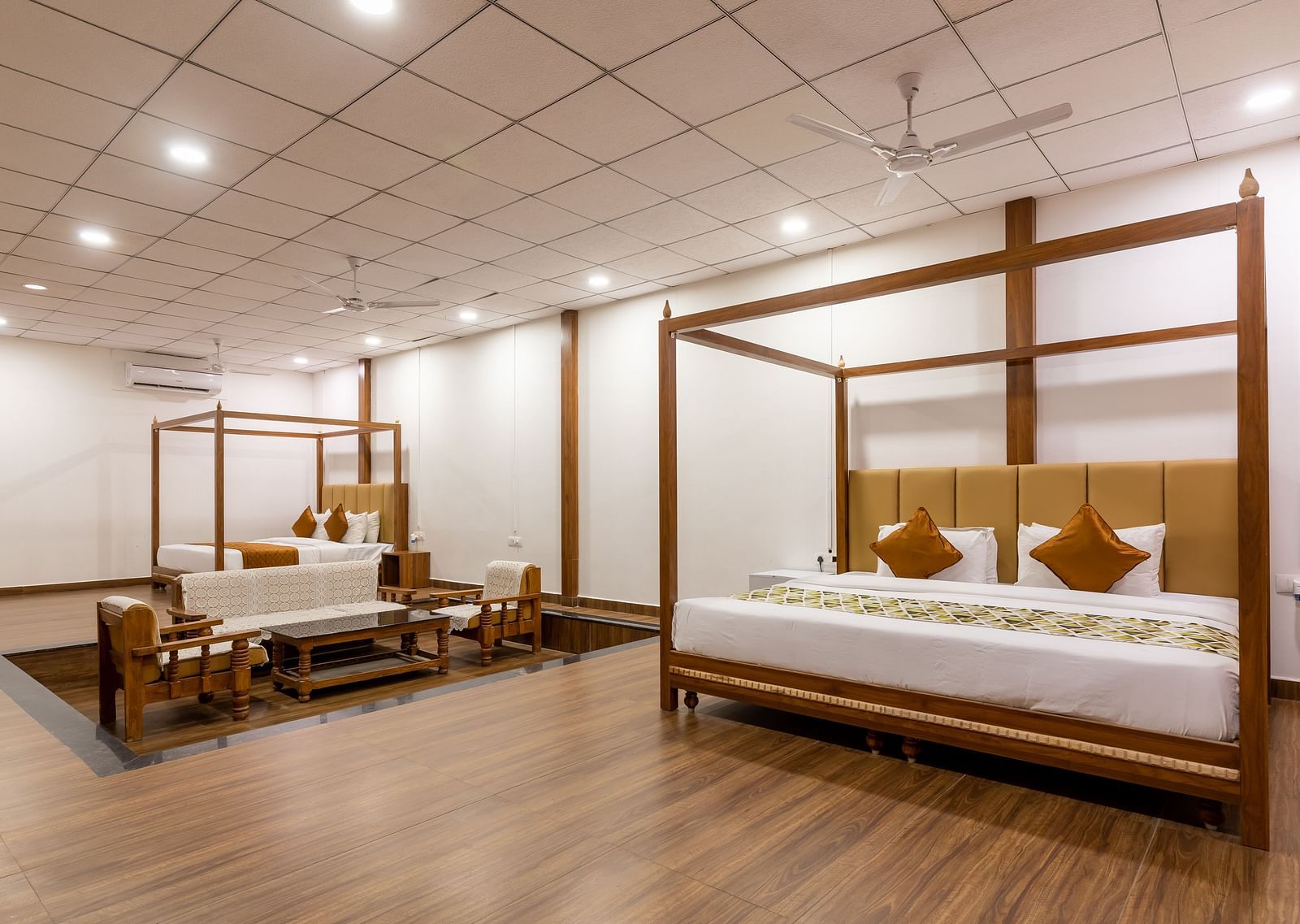 Suite at TGI Hotels and Resorts with a double bed