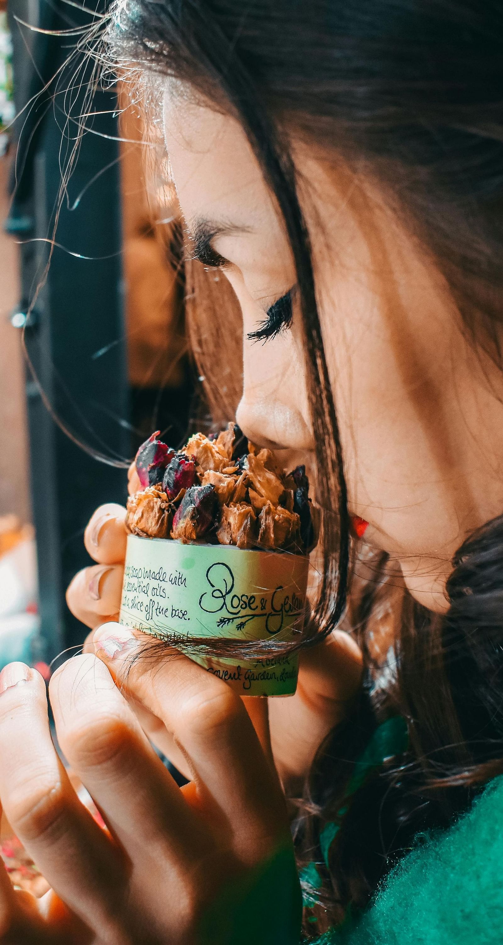 An image of a women sniffing the aroma of a product used in spa treatment