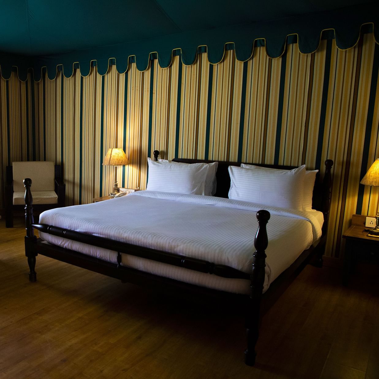 A spacious bedroom with a large bed and a sofa