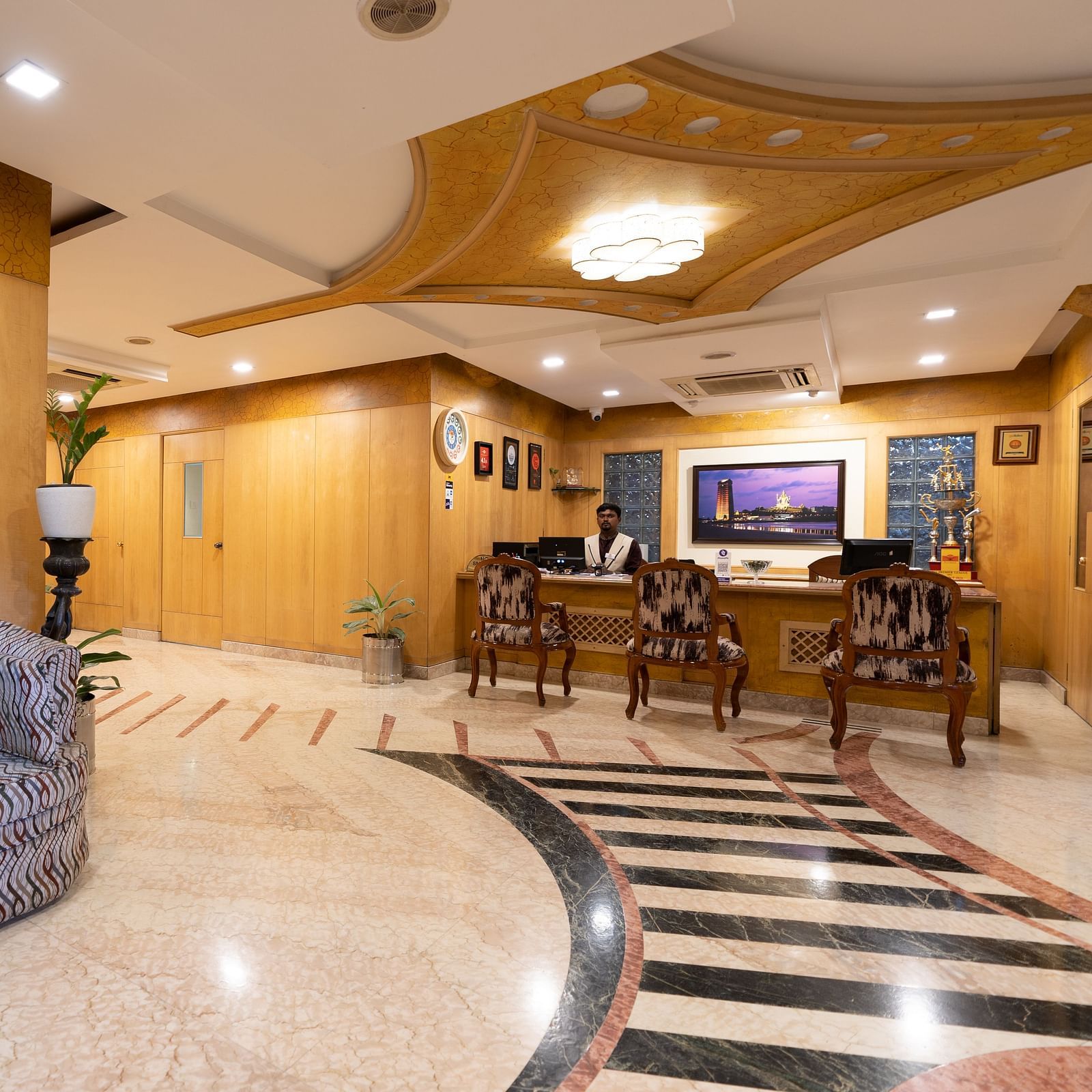 Overview of the lobby with seating arrangements - Hotel Pai Comforts, JP Nagar