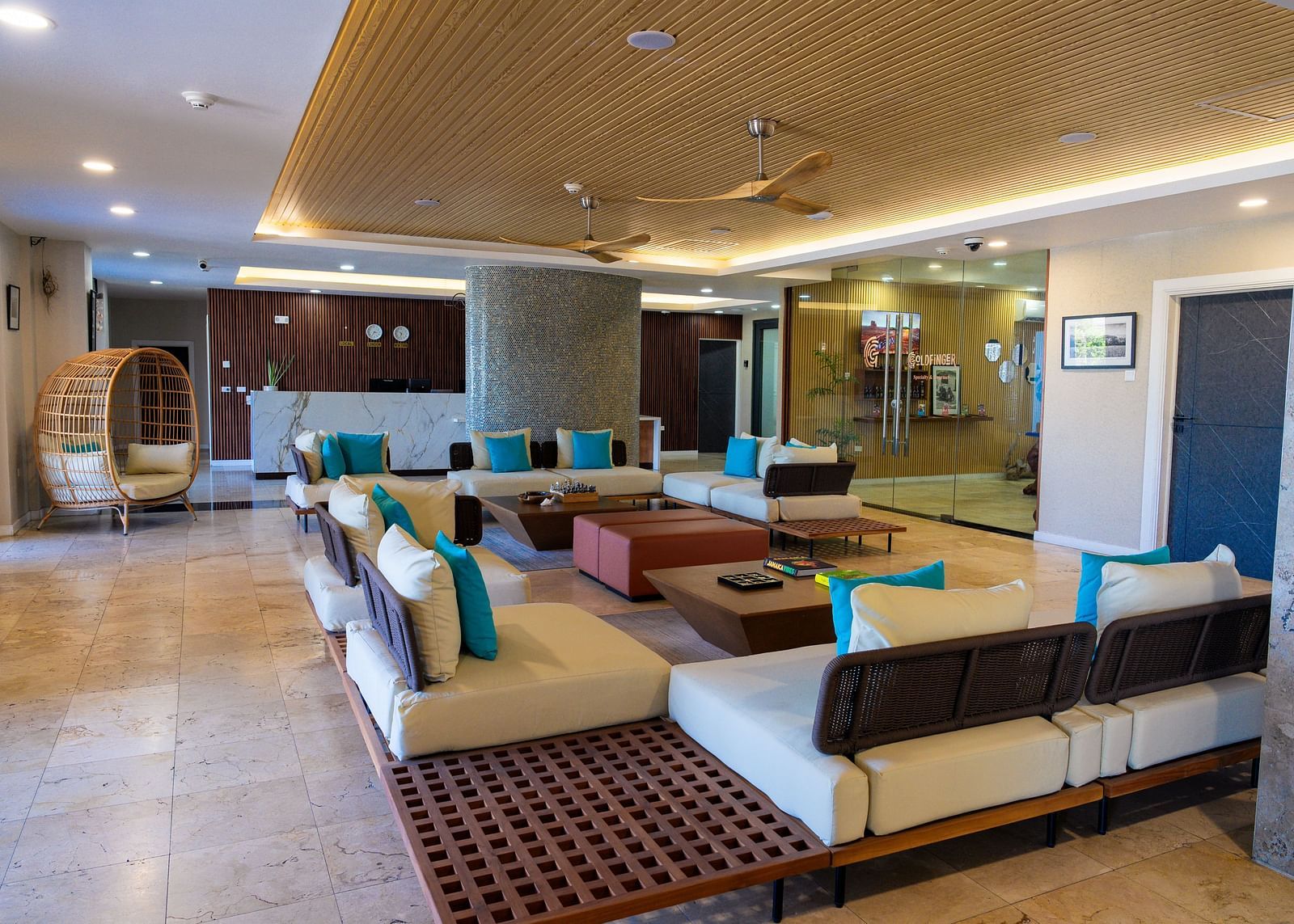 An image of a hotel lobby in Montego Bay featuring ambient lighting, cosy and contemporary looking sofas placed around a table - Hotel 39, Jamaica (Montego Bay)