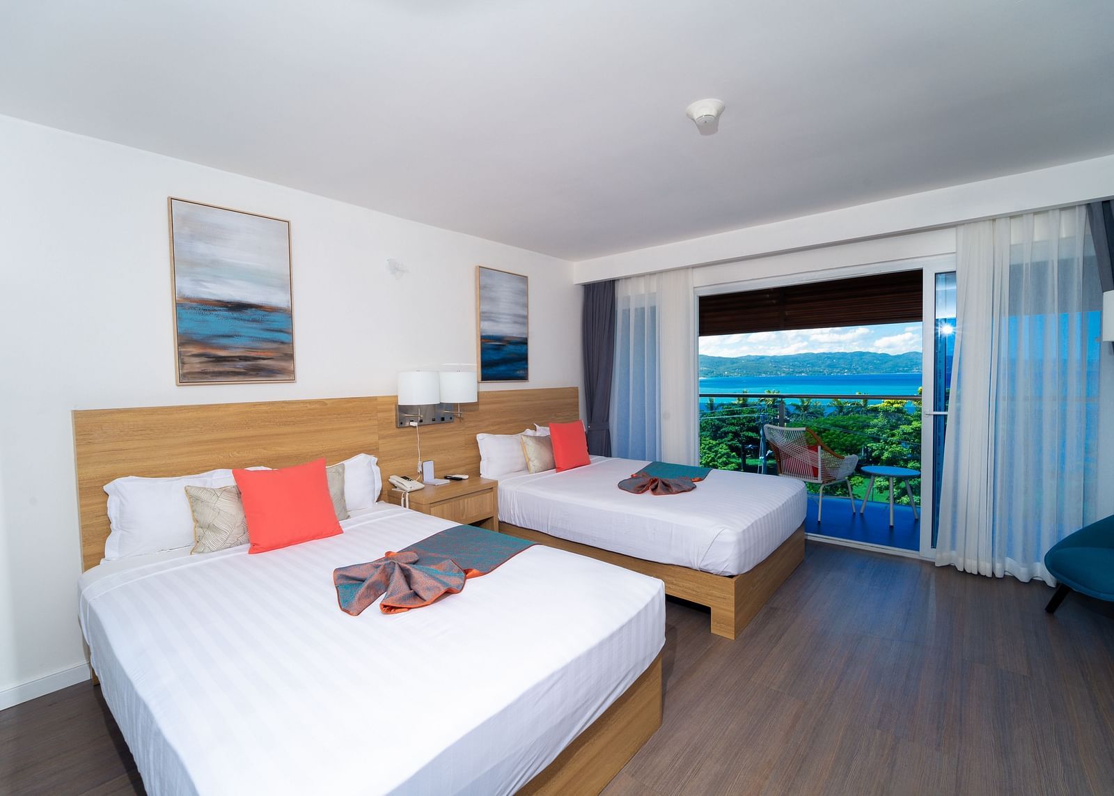 An image of a hotel room in Montego Bay with a balcony that offers the view of the shore - Hotel 39, Jamaica (Montego Bay)