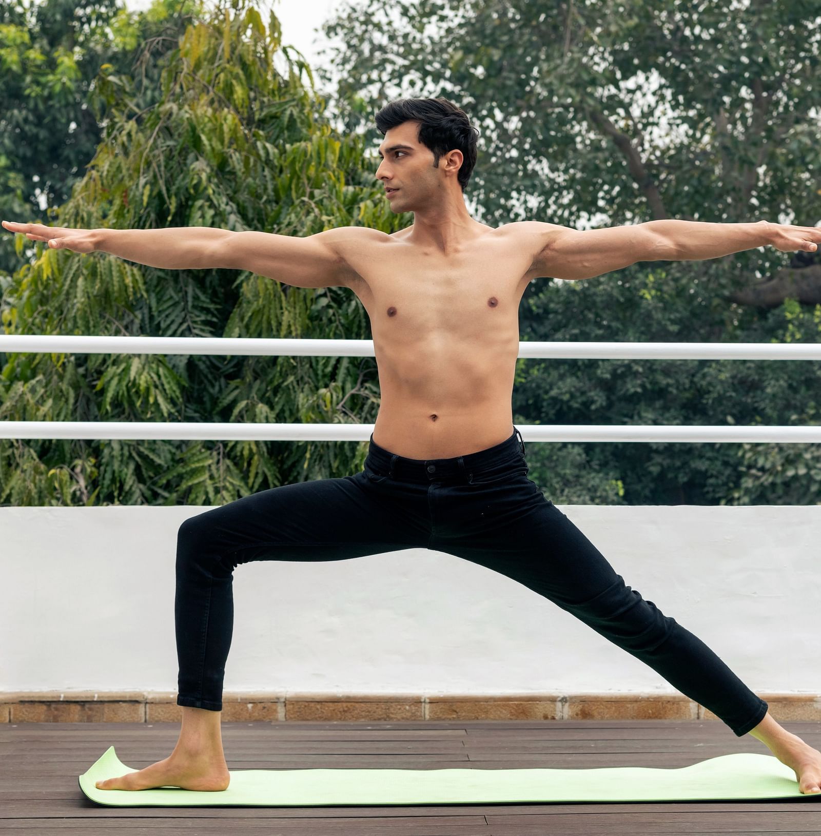 A gentleman practising yoga in a tranquil setting