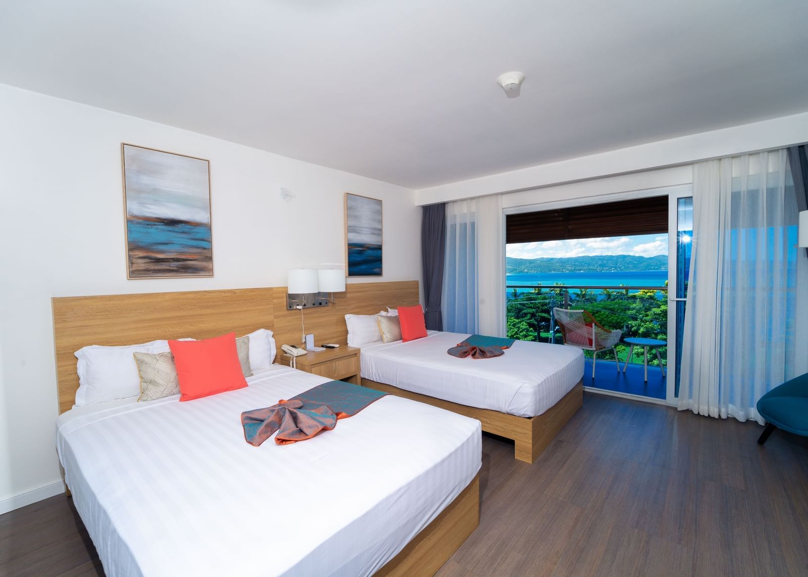 An image of a hotel room in Montego Bay with a balcony that offers the view of the shore - Hotel 39, Jamaica (Montego Bay)