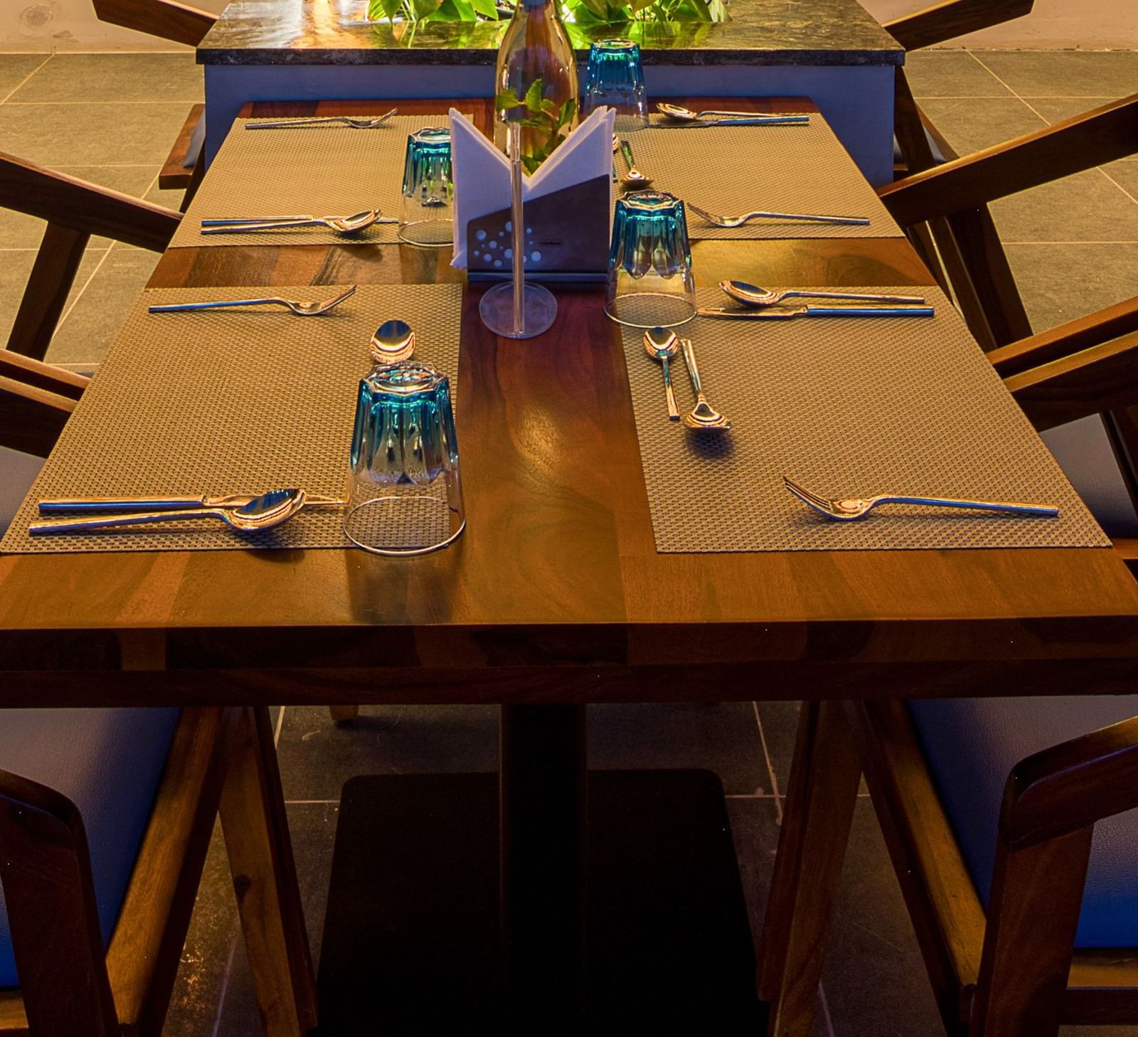 Interior of Roastopolis Restaurant at Le Foliage by TGI, Bangalore where tables and chairs are well aligned