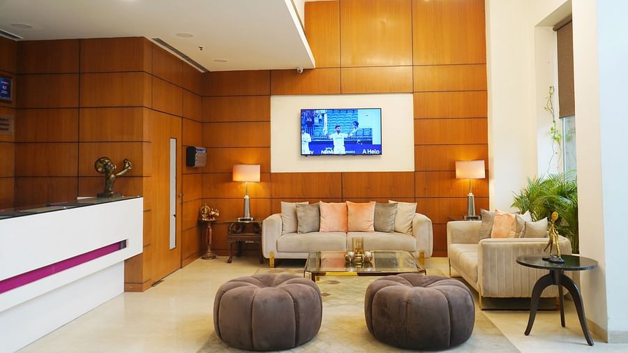 Elegant reception area at Nemesia with a warm colour scheme and comfortable seating for guests.