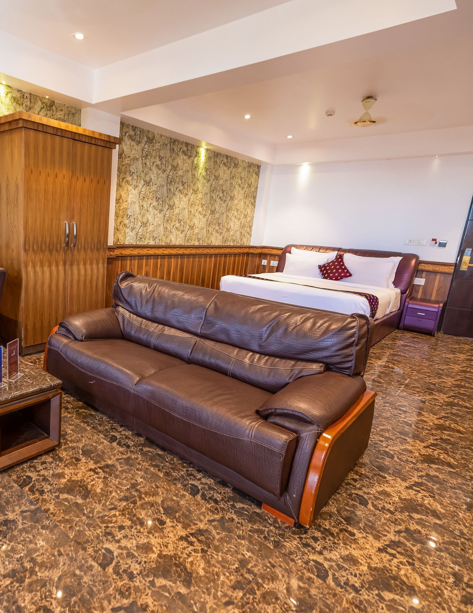 Two large sofas and a king size bed Inside the 90 Degree Club Suite at Parakkat Nature Hotel Resort Munnar 2