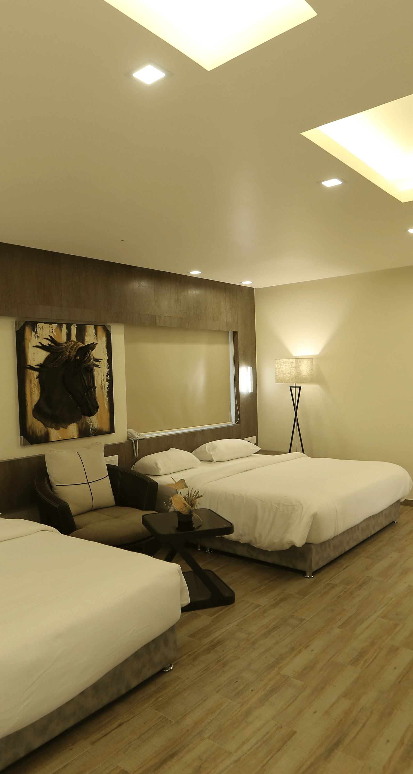 Club Suite featuring multiple beds and a desk area.