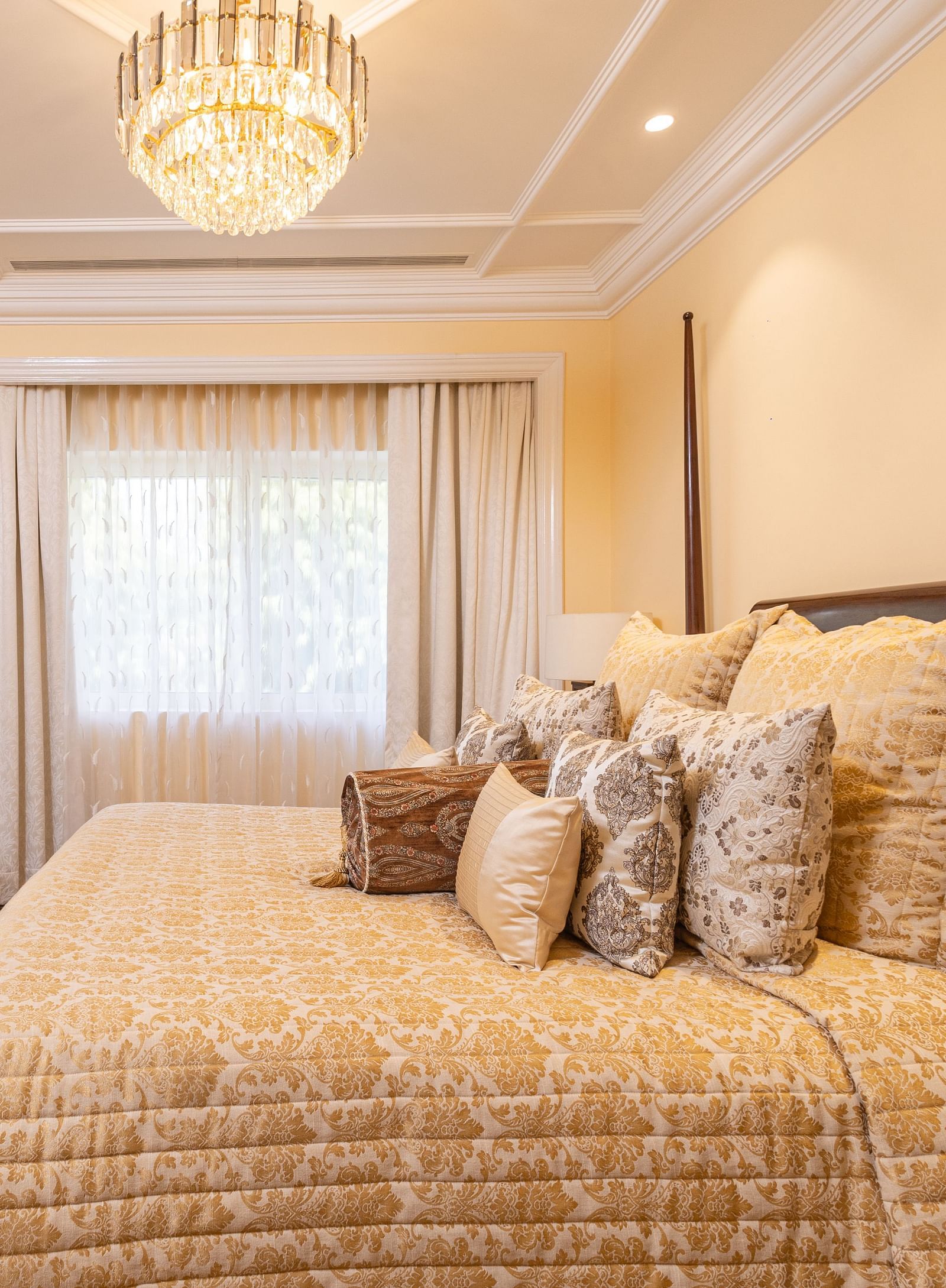 image of plush king size bed with a wall mounted tv placed opposite to the bed at our lutyens luxury suite - The Claridges New Delhi