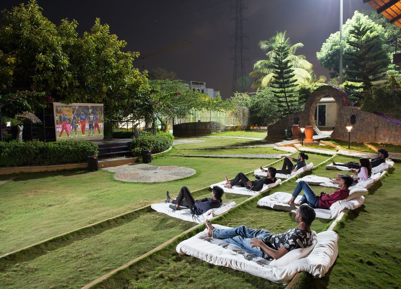 Open lawn setup with picnic-style seating at Nirantara Resort.