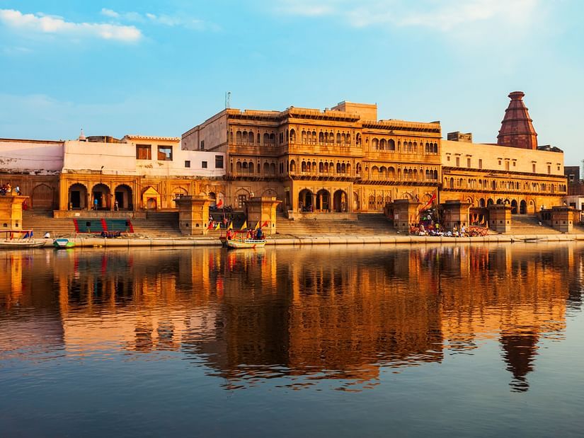 a temple reflected in a water body