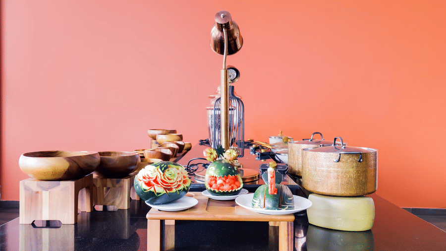 Colorful food spread with traditional serving vessels at Mount Himalayan Hotel & Spa restaurant.