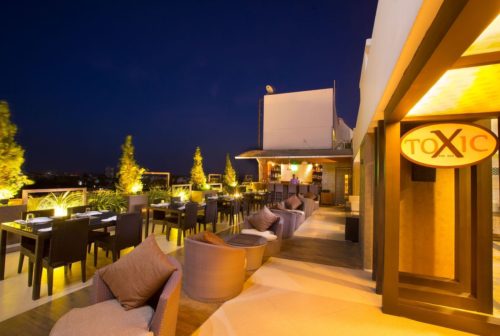 Toxic Rooftop Bar featuring plush sofa and cushion at Hotel Atithi - TGI Grand, Pondicherry