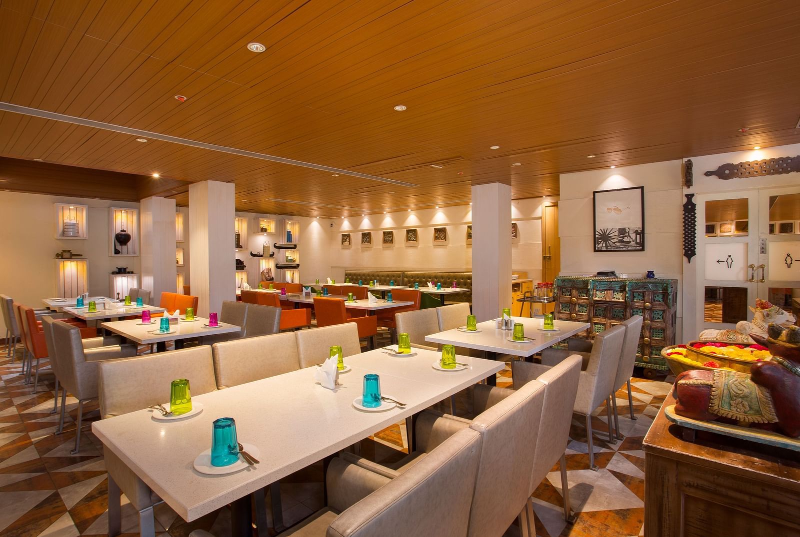 view of a restaurant with rows of rectangular tables with chairs on the long sides - Hotel Fountain Tree By TGI - JP Nagar, Bangalore