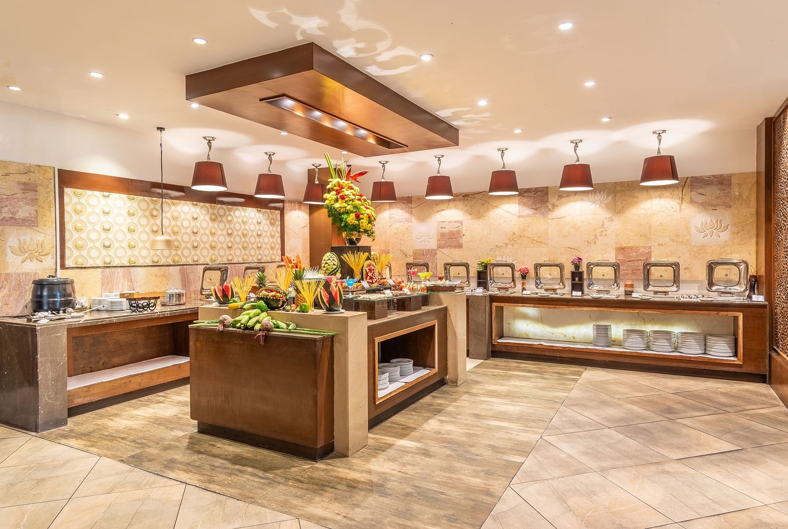 Buffet counter in a hotel restaurant decorated with fresh flowers- TGI Grand Fortuna, Krishnagiri Main Road, Hosur