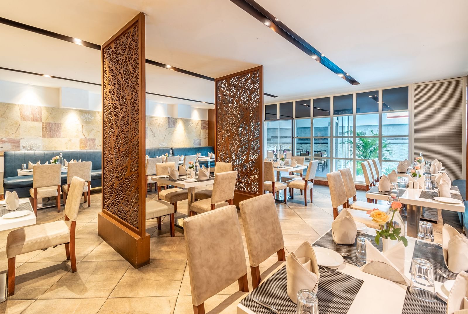 Elegant restaurant layout with decorative partitions and cosy seating- TGI Grand Fortuna, Krishnagiri Main Road, Hosur