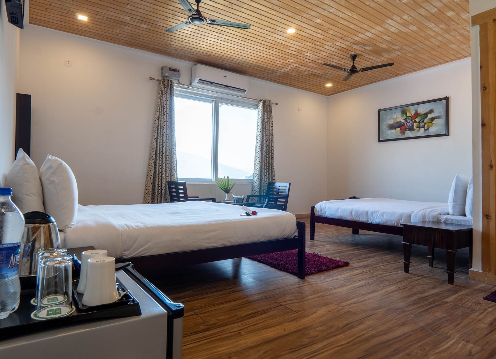 Family Room On Land closeup view of posh bedding and white duvet - Le ROI Floating Huts Eco Rooms4