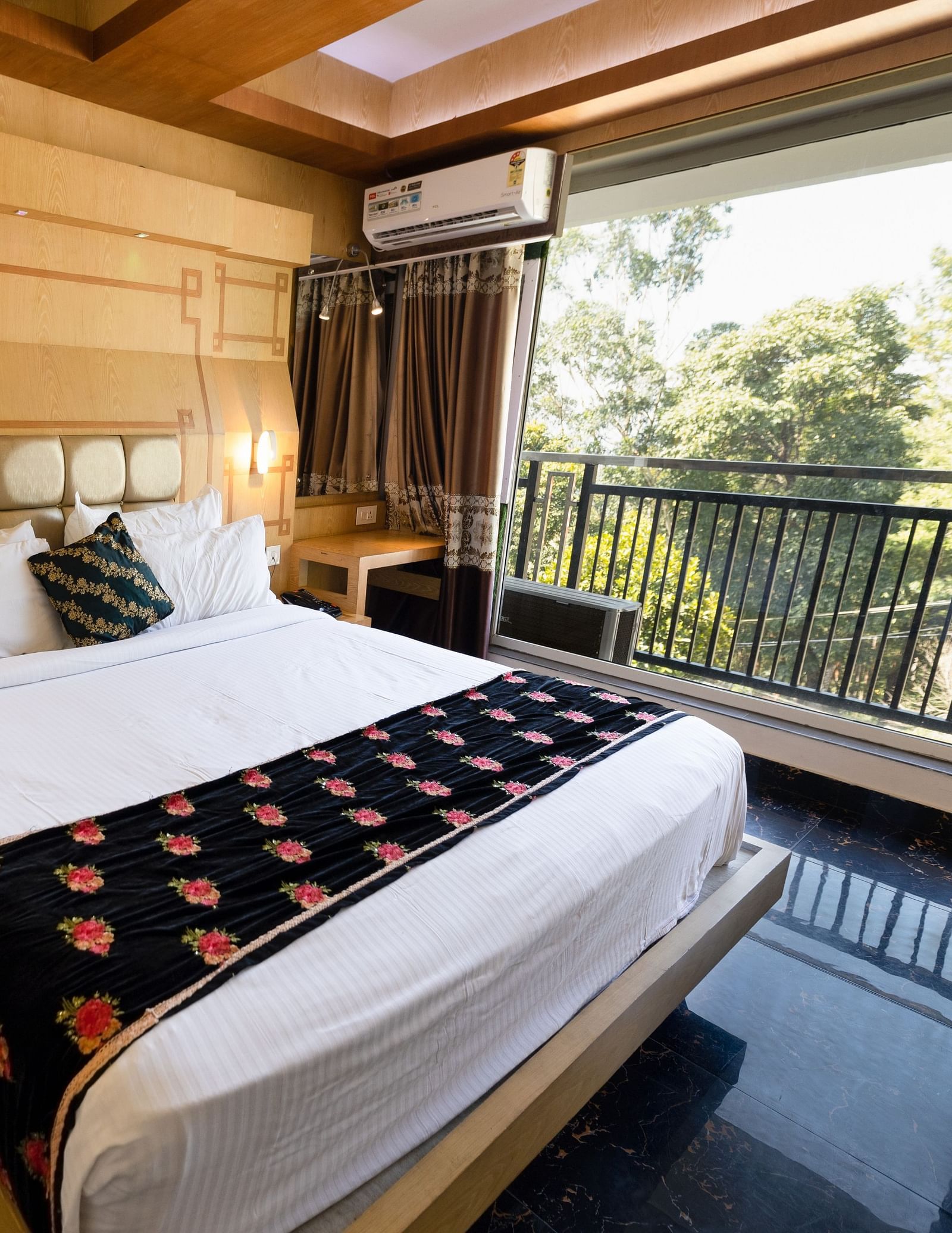 Wide view of the double bed in the Superior Room at Parakkat Nature Hotel and Resorts Munnar 1