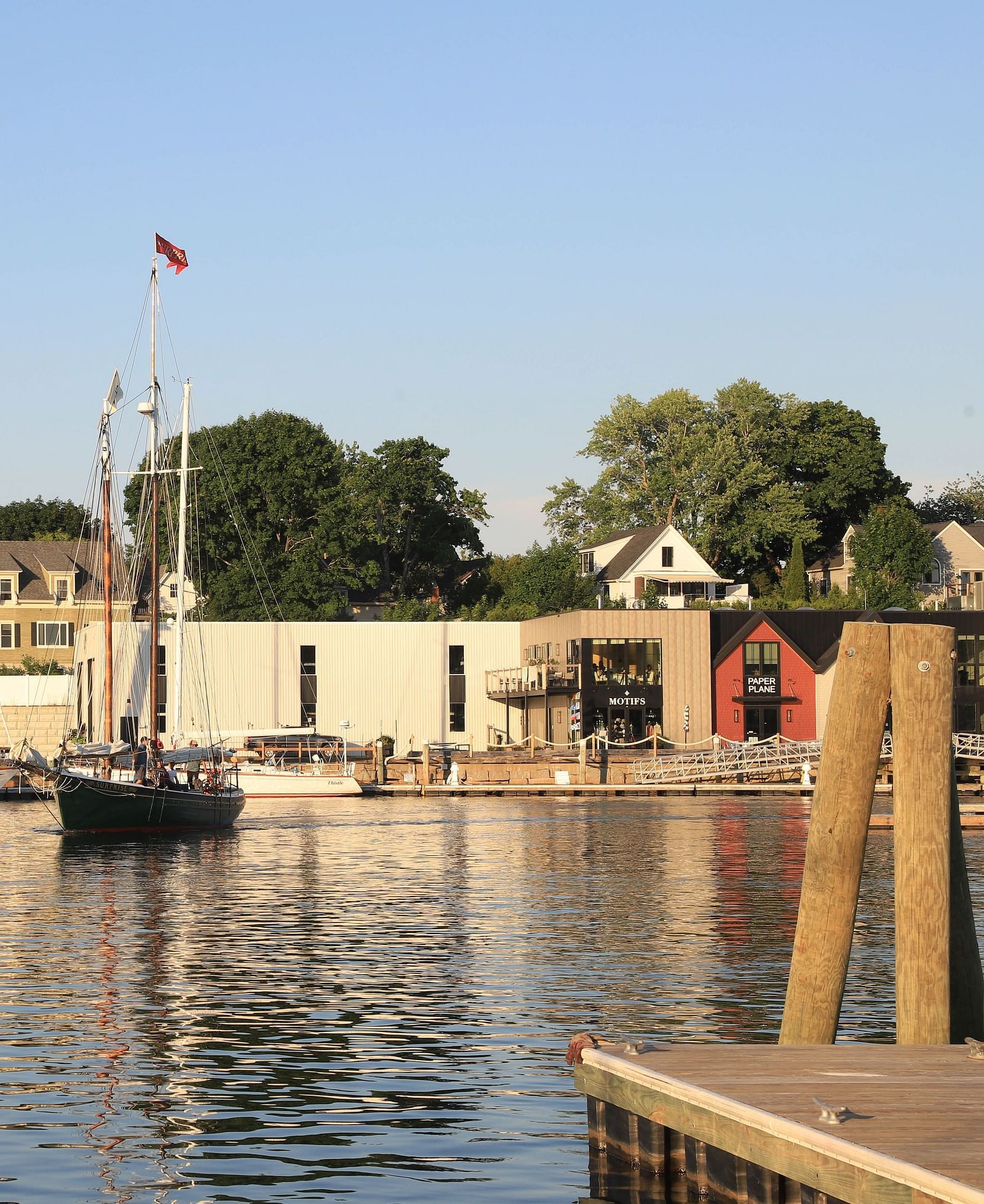 Picturesque harbour view with moored boats and waterfront buildings near Hartstone Inn