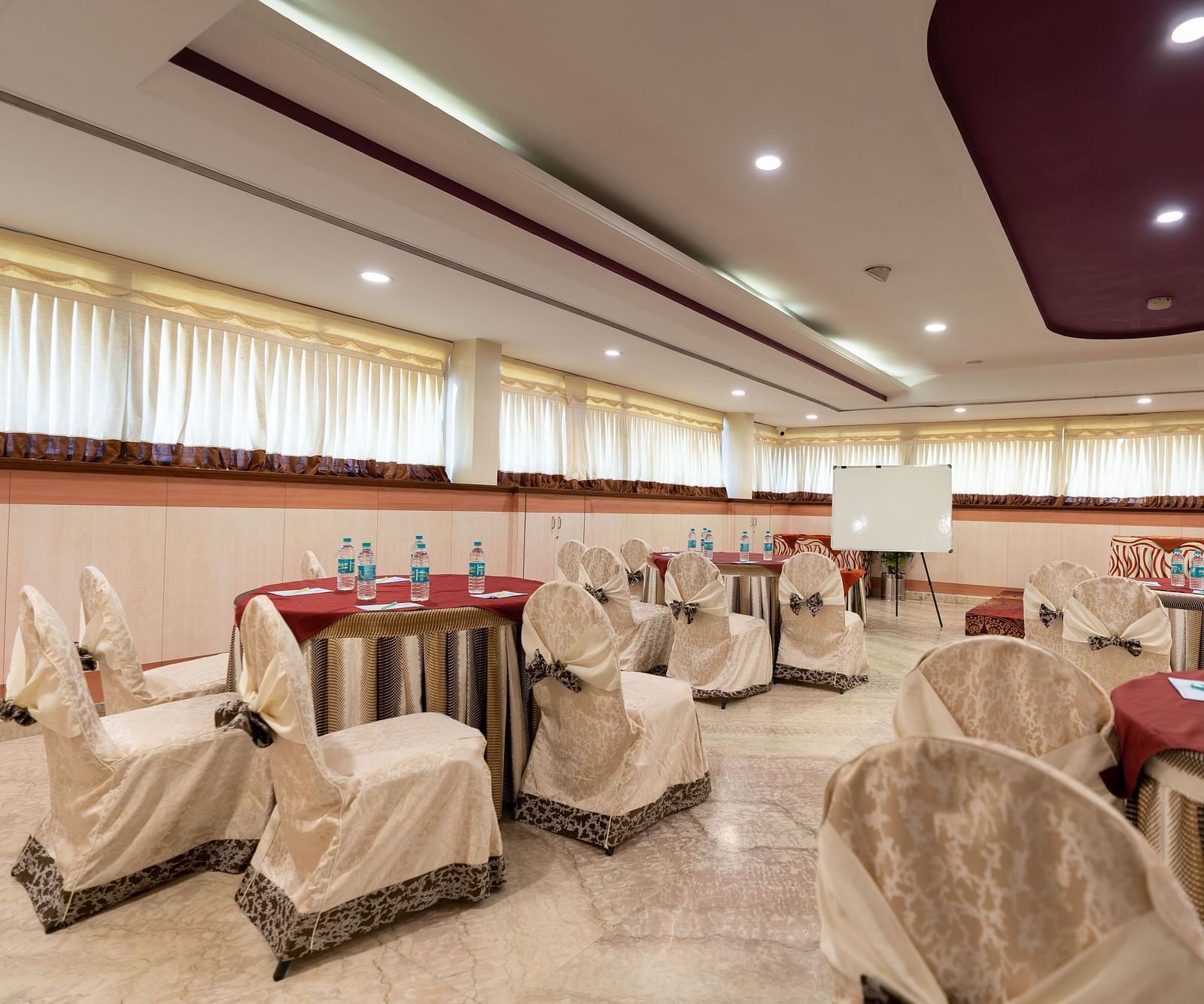 Seating arrangements inside the banquet hall - Hotel Pai Comforts, JP Nagar