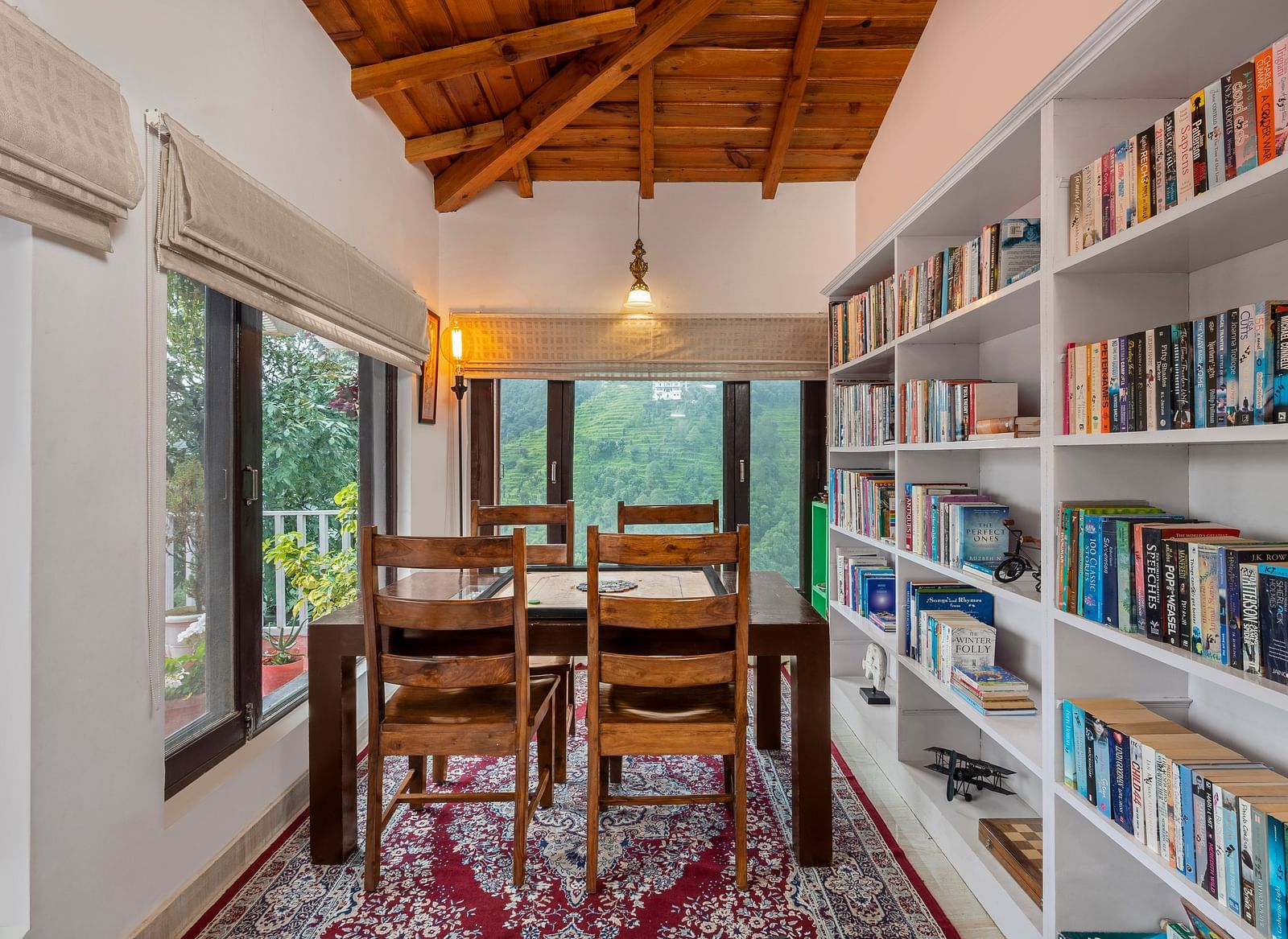 Cosy reading corner with bookshelves and window-side seating, at BluSalzz Collection - Suvaasa Resort, Ramgarh.
