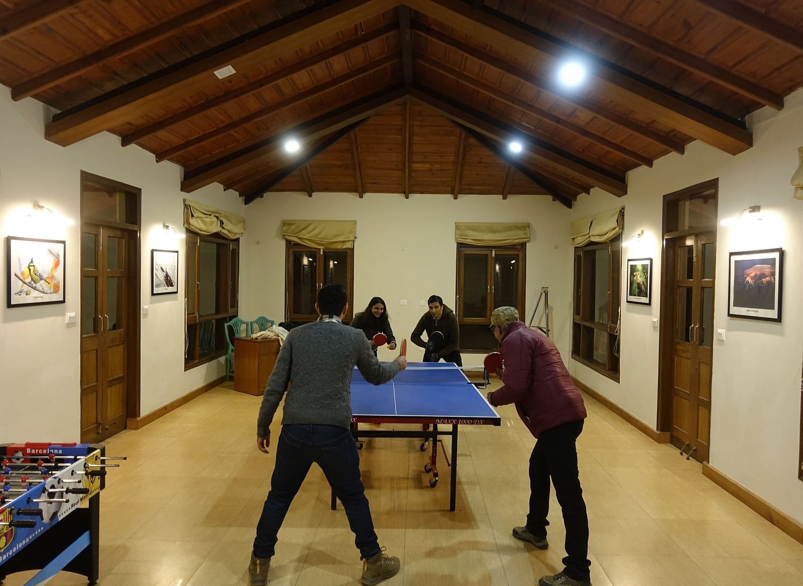 Guests enjoying a game of table tennis in the recreational room - BluSalzz Escapade - Anant Rasa Resort