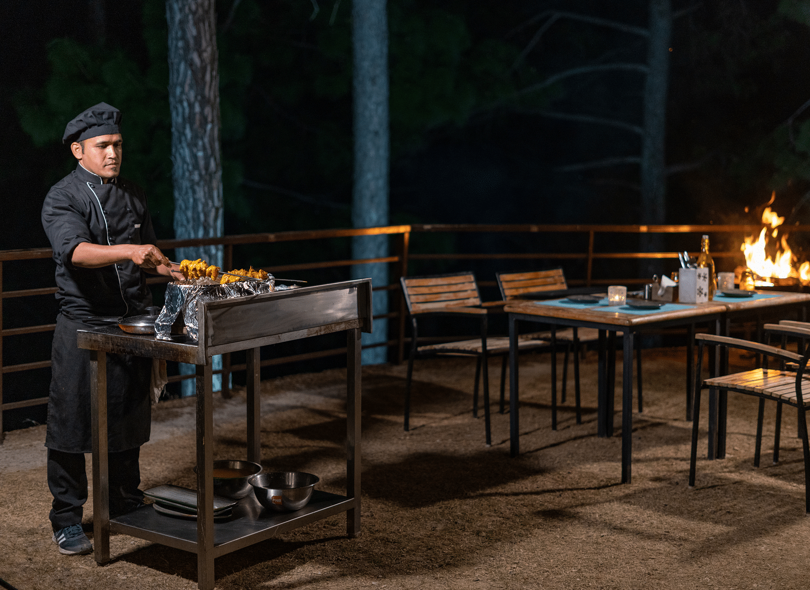 Chef performing a live barbecue session in the garden at BluSalzz Escapade Resort, Lansdowne.