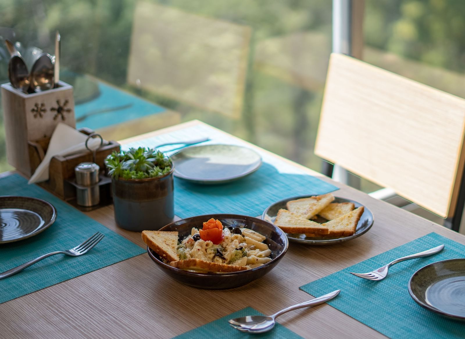 A dish placed on a table with cutlery arranged beside it at BluSalzz Escapade Resort, Lansdowne