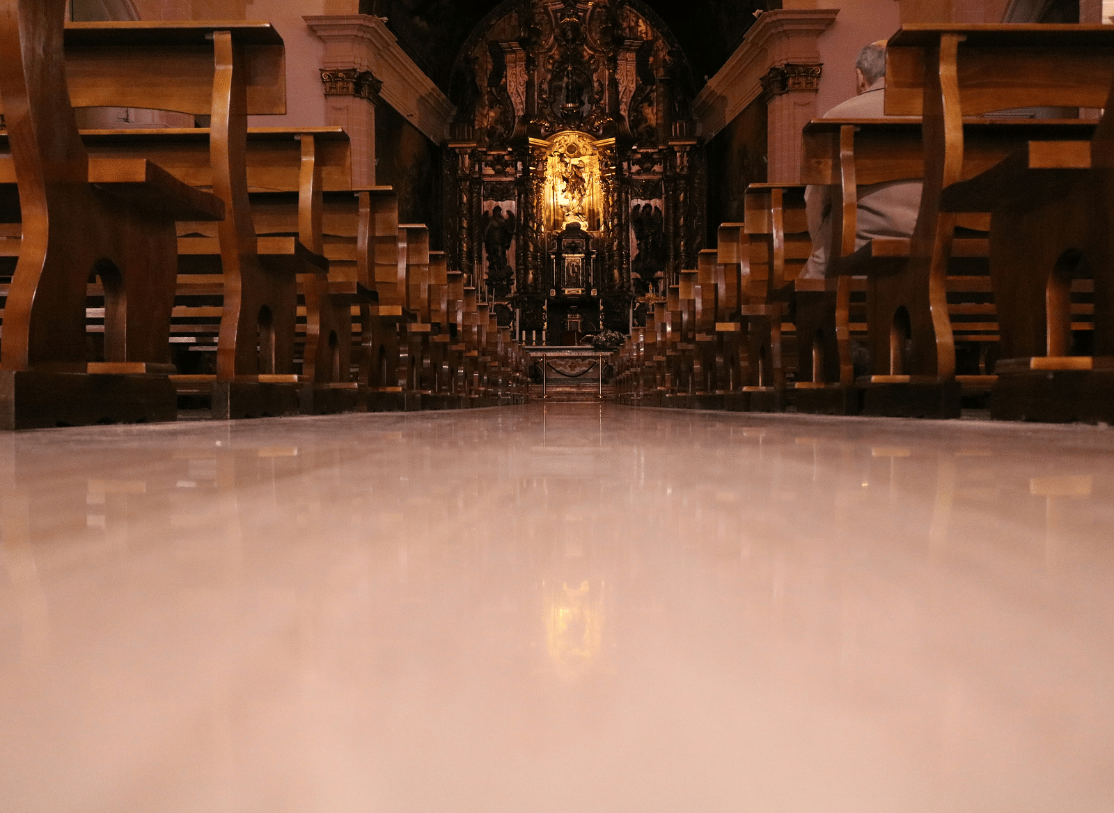 Interior view of the church featuring chairs and tables arranged in the space.
