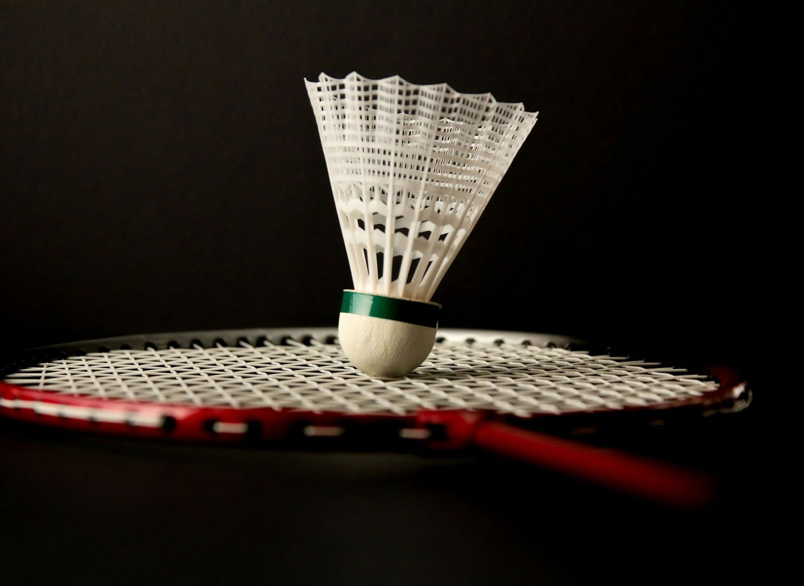 Shuttlecock placed on a racket.
