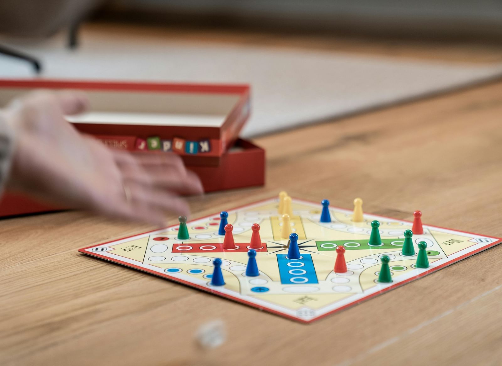 A close up shot of a game of ludo