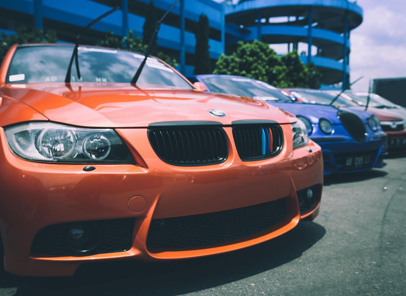 A car parked alongside a row of other vehicles.