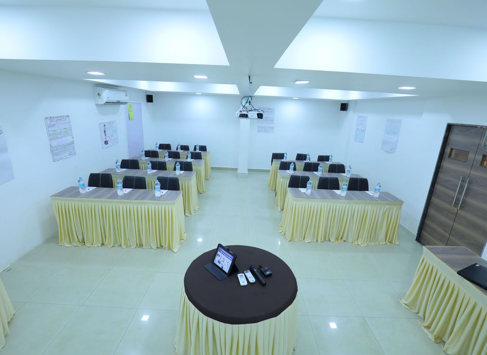 Classroom seating arrangement, projector, air-conditioning in the spacious Olive banquet hall, with ample lighting, at Highland Resort.