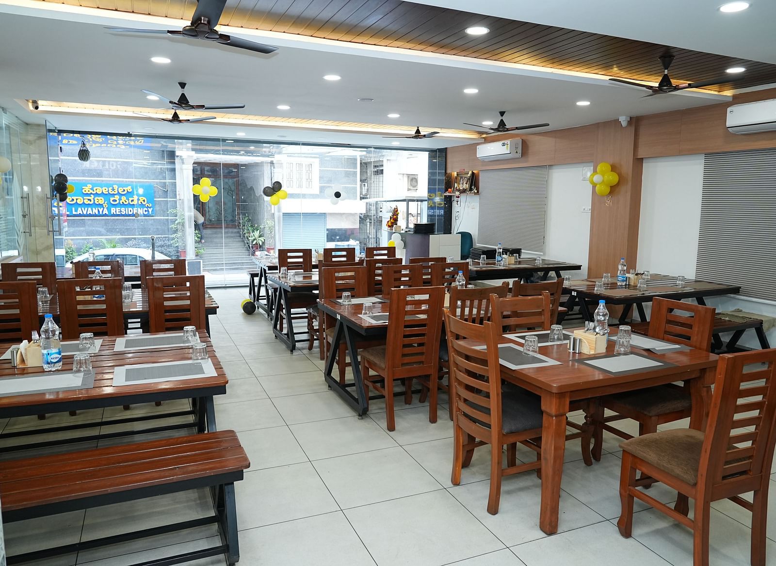 the restaurant at our hotel featuring the entrance made with huge glass windows - Hotel Grand Sigma