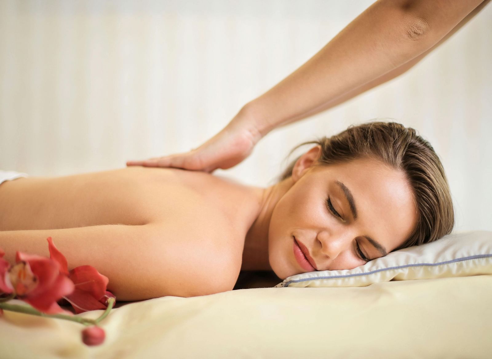 A person receiving a back massage.
