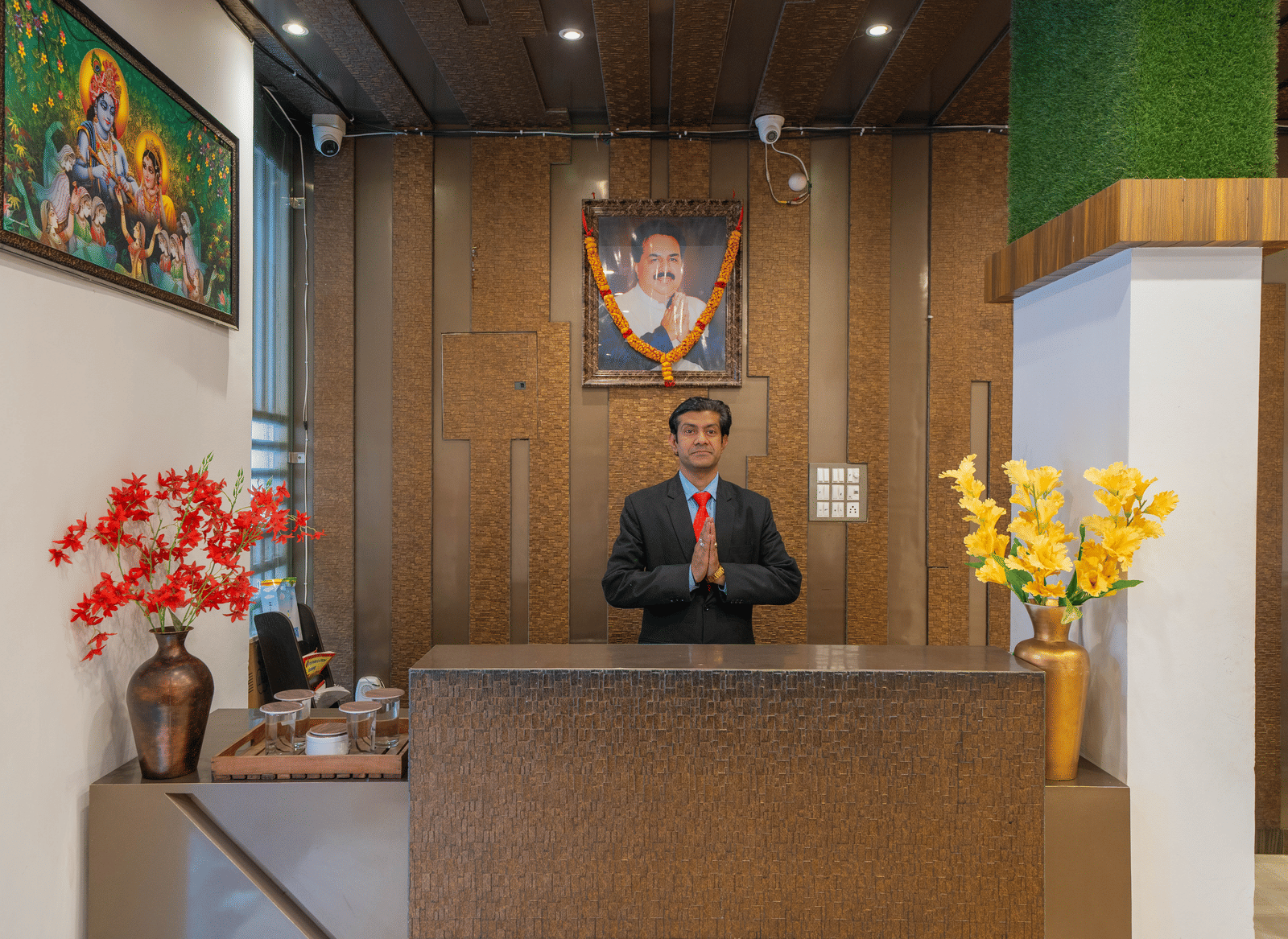 Hotel Reception Desk with an attendant standing behind it - Perfectstayz Premium at Har Ki Pauri Road (Ganga Heights)