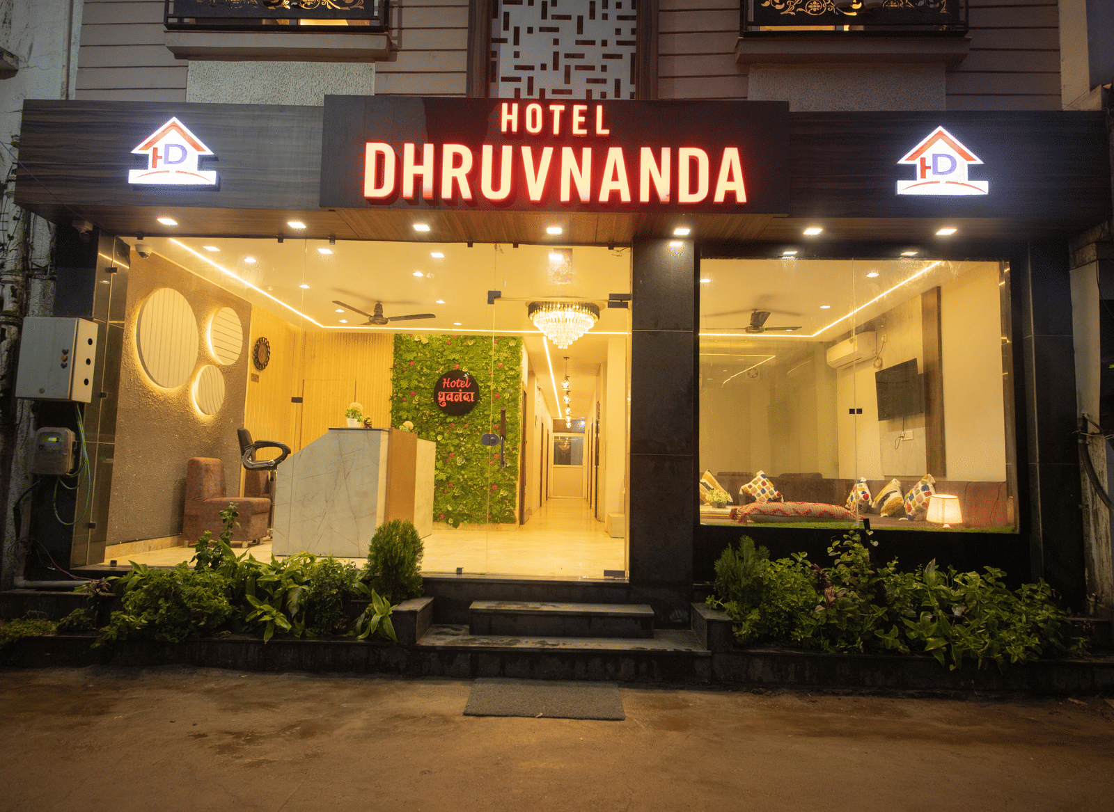 Exterior of Perfectstayz Value Dhruv Nanda featuring the entrace of the hotel during the night.