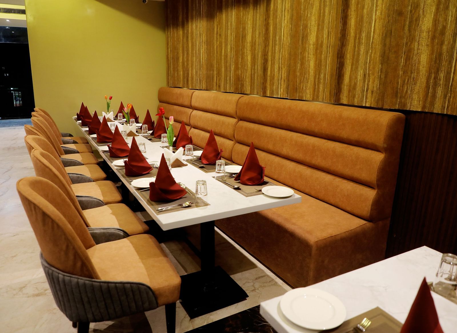 Private dining booths at Town Square Suites restaurant with intimate seating and elegant decor