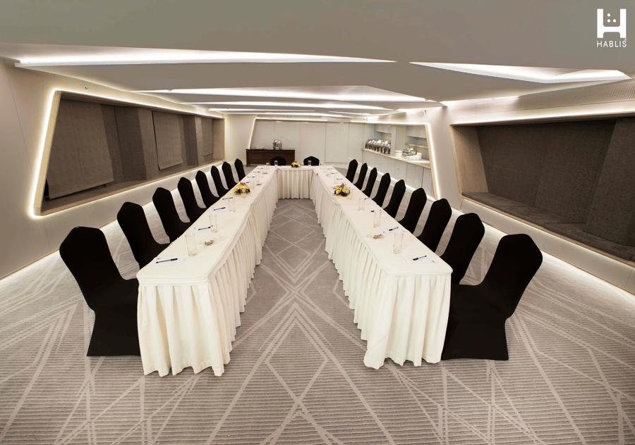 Contemporary boardroom setup with conference seating and presentation facilities for corporate meetings and workshops | Hablis Hotel Chennai