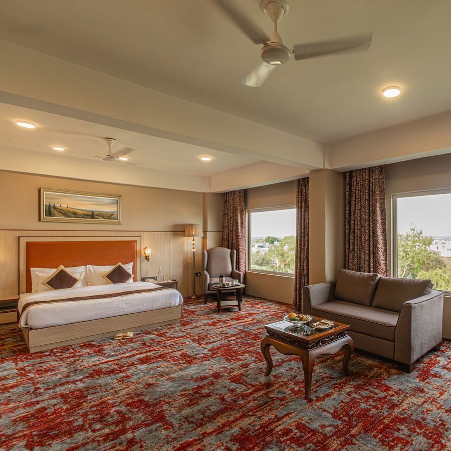 Modern living area in a hotel room at The Lalita Grand