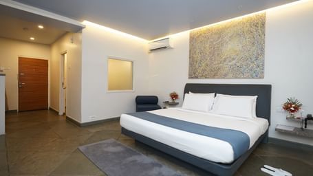 A deluxe bedroom with twin beds and other room amenities - Argo By Trance, Goa