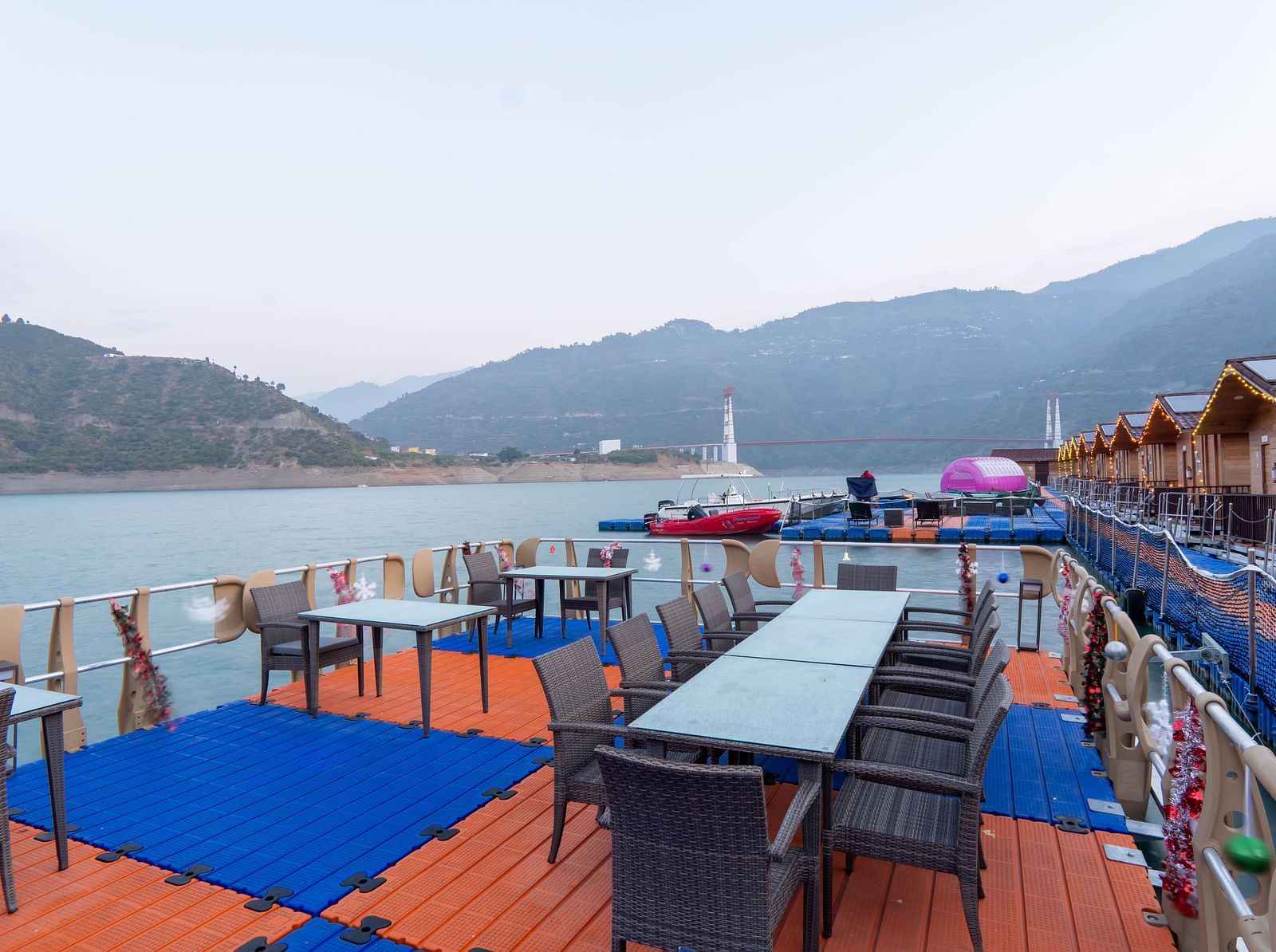 bedroom and dining area view at Floating Huts - Over the Lake captured during the day at Le ROI Floating Huts Eco Rooms4