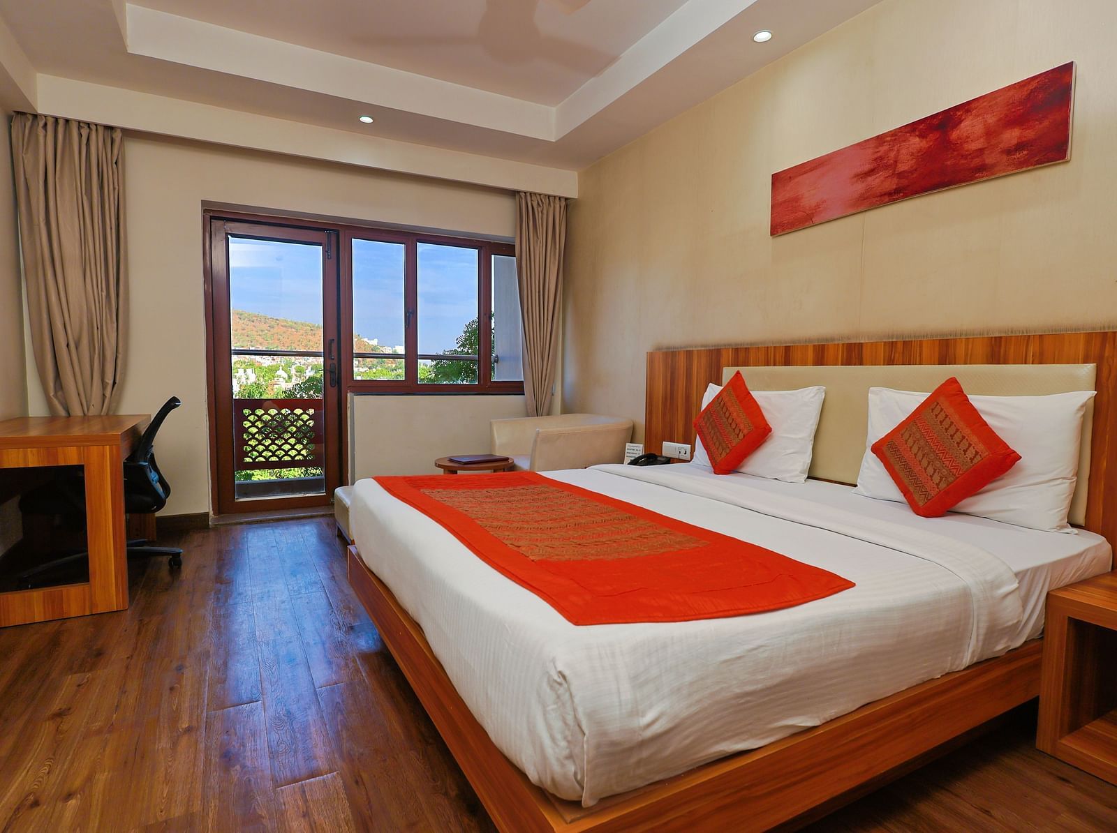 Golden Premium with Balcony and a pluhsy bed