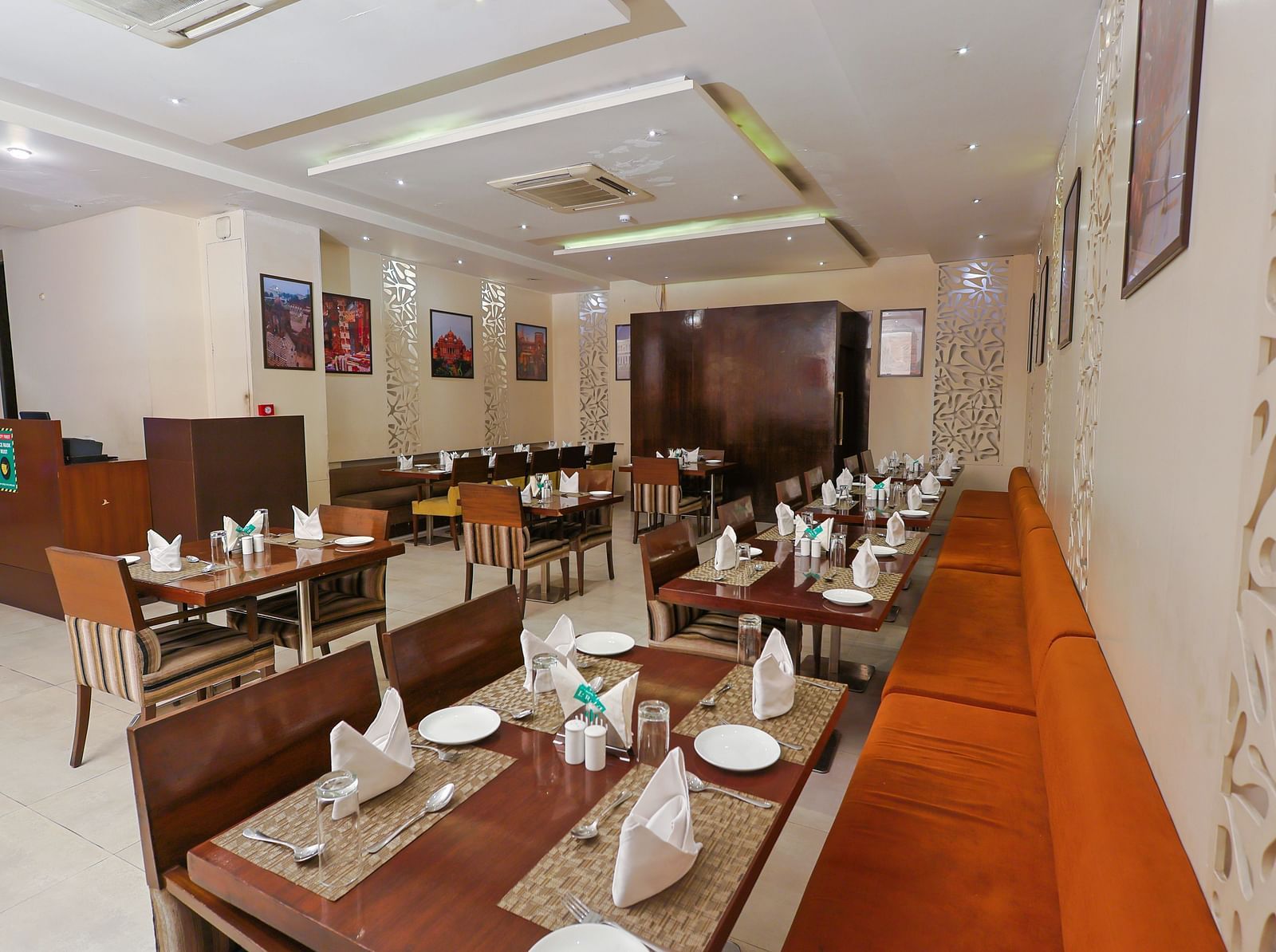 A restaurant with bright lighting that highlights the elegantly set table, ready for serving the culinary dishes