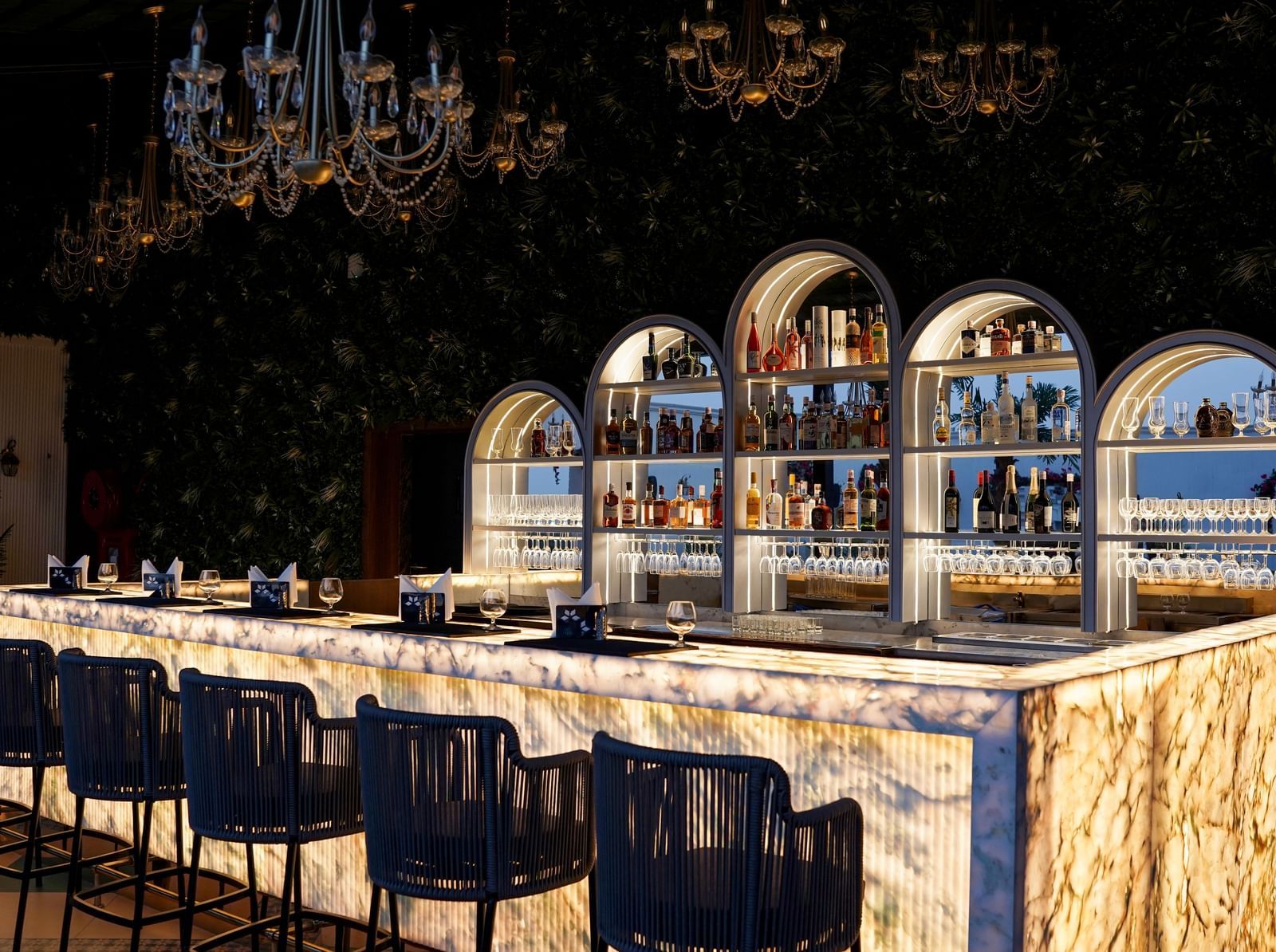 Corner view shot of the bar counter featuring an extensive collection of premium liquor for display at the Sky Roof at M2 Square by Monday Premium.